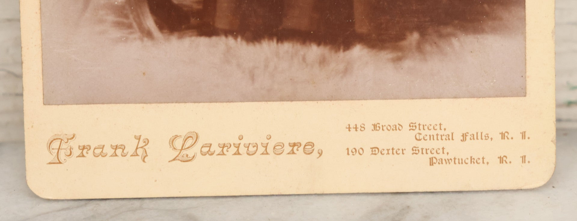 Lot 019 - Antique Cabinet Card Photograph Of A Bearded Priest In Black Robe With Large Pectoral Crucifix Tucked In Belt, Frank Lariviere, Photographer, Central Falls & Pawtucket, Rhode Island