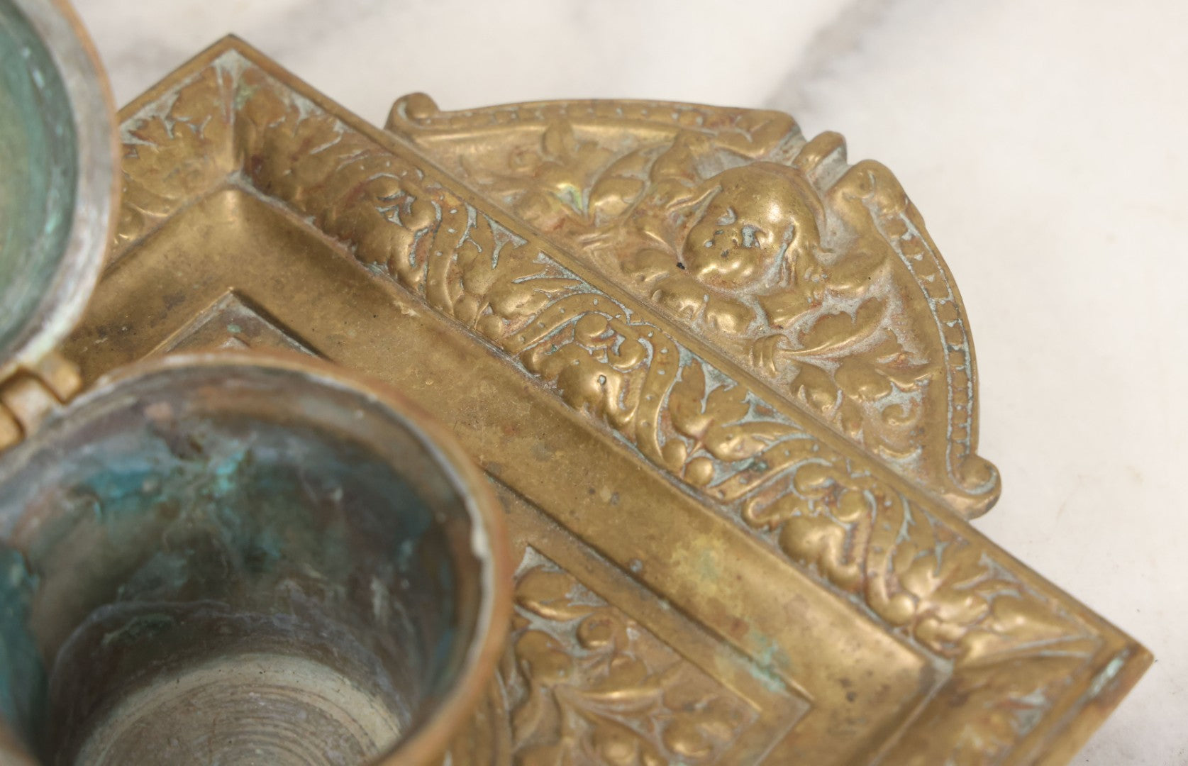 Lot 027 - Antique Cast Brass Double Inkwell And Desk Tray With Cherub And Green Man Motifs, Hinged Lids, Underside Marked 3143, No Inserts