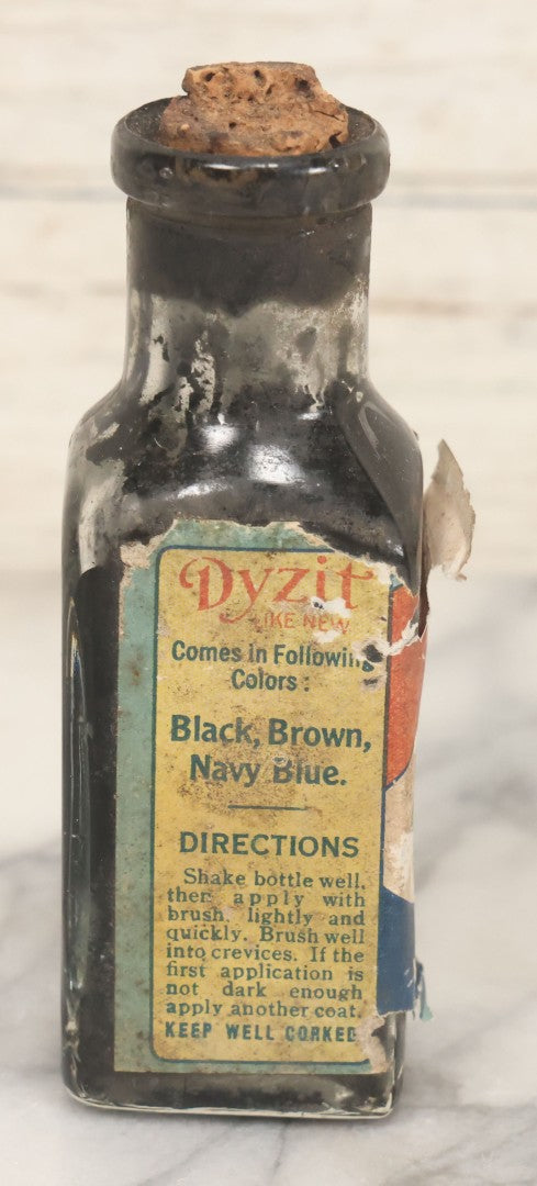 Lot 040 - Grouping Of Four Vintage Ink And Polish Glass Bottles With Paper Labels Including Dyzit Straw Hat Renewer, Sanford's Premium Writing Fluid, Bixby Mahogany Shoe Cleaner, And Bixby Royal Shoe Polish