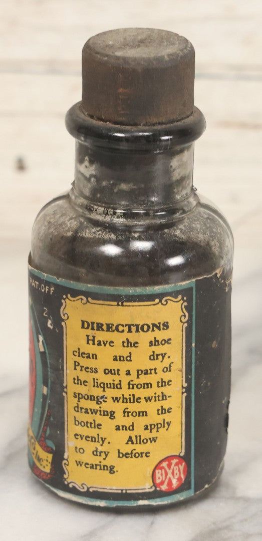 Lot 040 - Grouping Of Four Vintage Ink And Polish Glass Bottles With Paper Labels Including Dyzit Straw Hat Renewer, Sanford's Premium Writing Fluid, Bixby Mahogany Shoe Cleaner, And Bixby Royal Shoe Polish