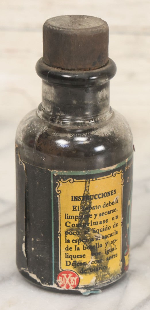 Lot 040 - Grouping Of Four Vintage Ink And Polish Glass Bottles With Paper Labels Including Dyzit Straw Hat Renewer, Sanford's Premium Writing Fluid, Bixby Mahogany Shoe Cleaner, And Bixby Royal Shoe Polish