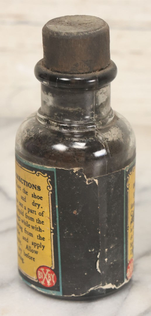 Lot 040 - Grouping Of Four Vintage Ink And Polish Glass Bottles With Paper Labels Including Dyzit Straw Hat Renewer, Sanford's Premium Writing Fluid, Bixby Mahogany Shoe Cleaner, And Bixby Royal Shoe Polish