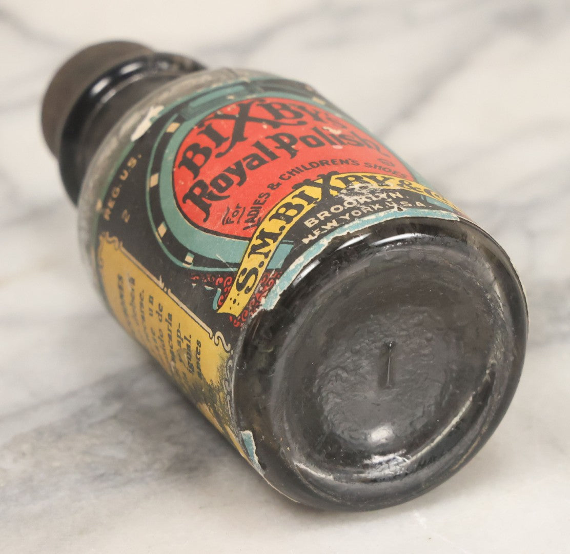 Lot 040 - Grouping Of Four Vintage Ink And Polish Glass Bottles With Paper Labels Including Dyzit Straw Hat Renewer, Sanford's Premium Writing Fluid, Bixby Mahogany Shoe Cleaner, And Bixby Royal Shoe Polish