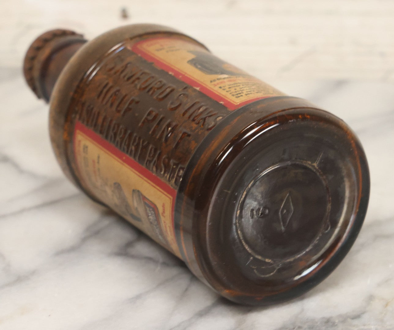 Lot 040 - Grouping Of Four Vintage Ink And Polish Glass Bottles With Paper Labels Including Dyzit Straw Hat Renewer, Sanford's Premium Writing Fluid, Bixby Mahogany Shoe Cleaner, And Bixby Royal Shoe Polish