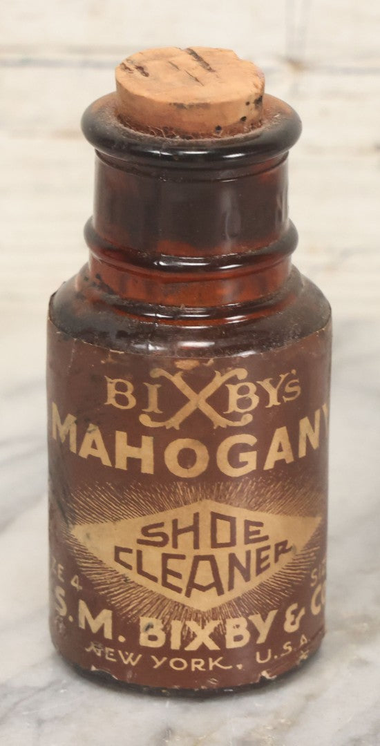 Lot 040 - Grouping Of Four Vintage Ink And Polish Glass Bottles With Paper Labels Including Dyzit Straw Hat Renewer, Sanford's Premium Writing Fluid, Bixby Mahogany Shoe Cleaner, And Bixby Royal Shoe Polish