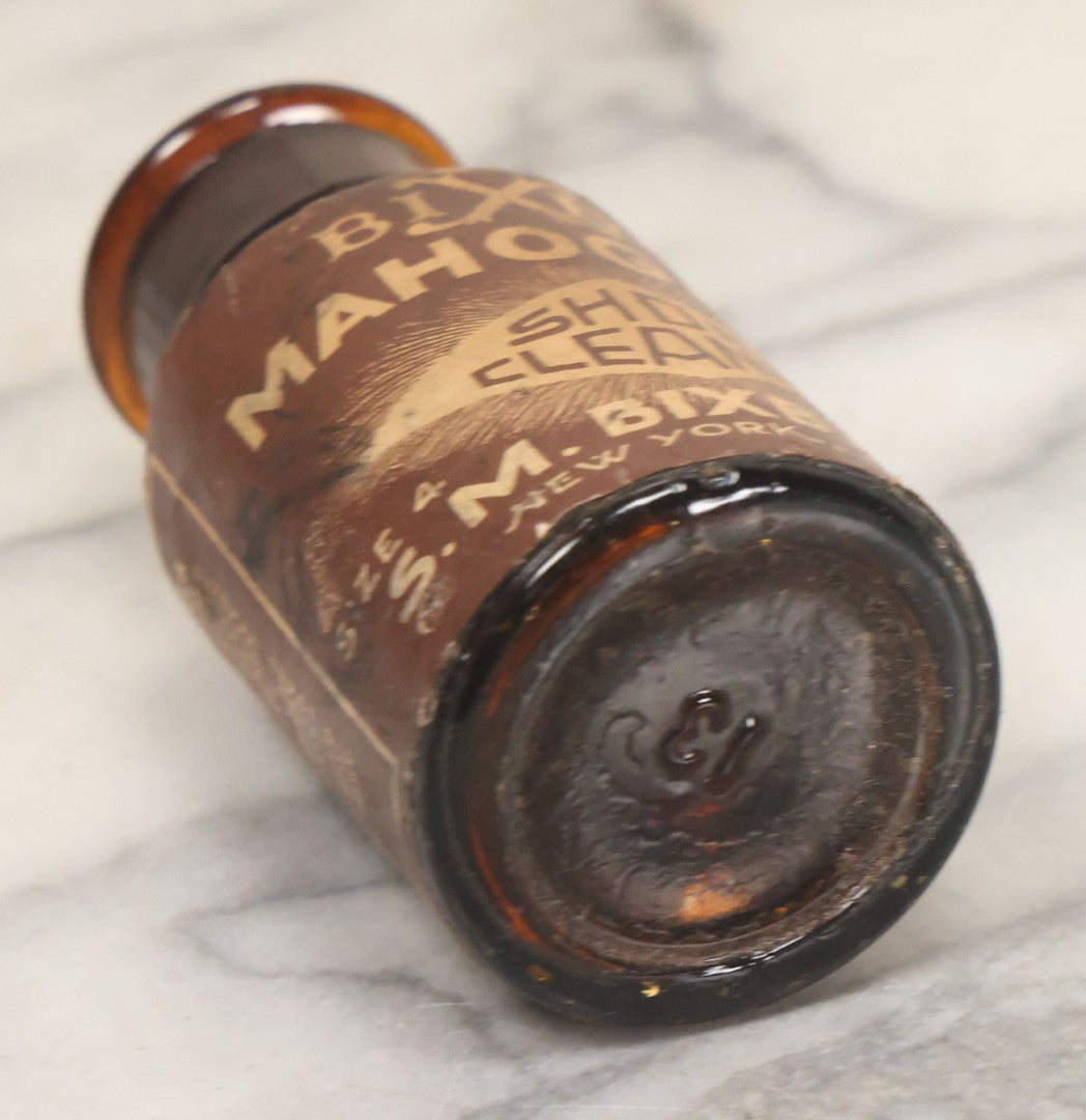 Lot 040 - Grouping Of Four Vintage Ink And Polish Glass Bottles With Paper Labels Including Dyzit Straw Hat Renewer, Sanford's Premium Writing Fluid, Bixby Mahogany Shoe Cleaner, And Bixby Royal Shoe Polish