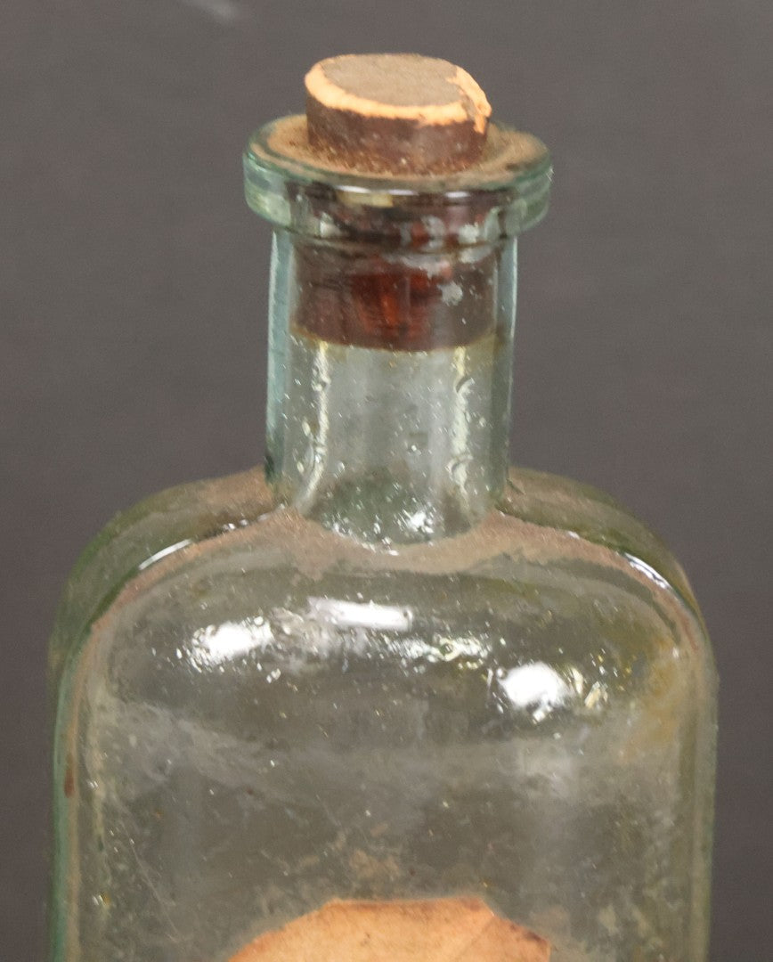 Lot 042 - Antique Superior Hair Oil Clear Glass Bottle With Cork And Remnants Of Contents, Paper Label, Manufactured And Sold By L.F. Wood, West Townsend, Massachusetts, 5-1/4" Height