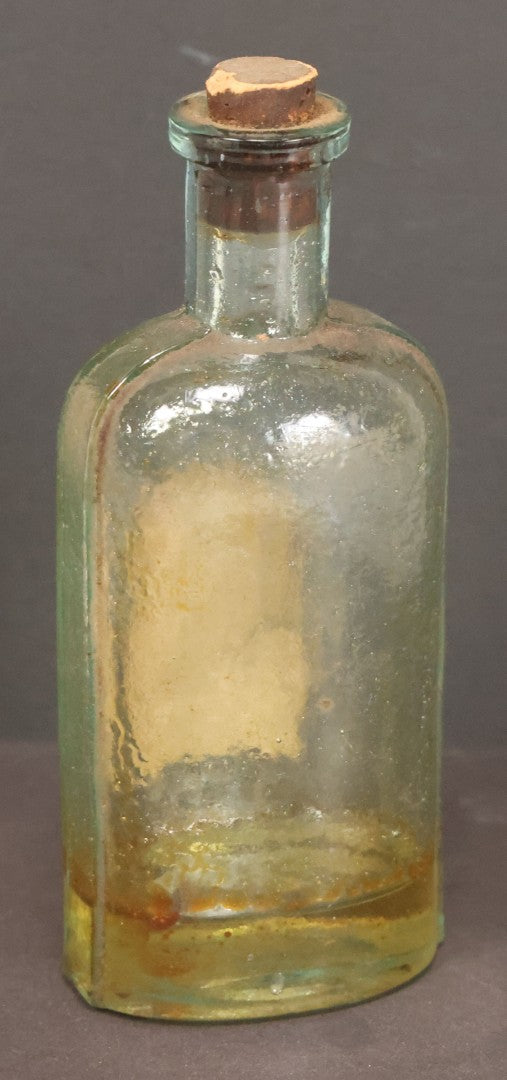 Lot 042 - Antique Superior Hair Oil Clear Glass Bottle With Cork And Remnants Of Contents, Paper Label, Manufactured And Sold By L.F. Wood, West Townsend, Massachusetts, 5-1/4" Height