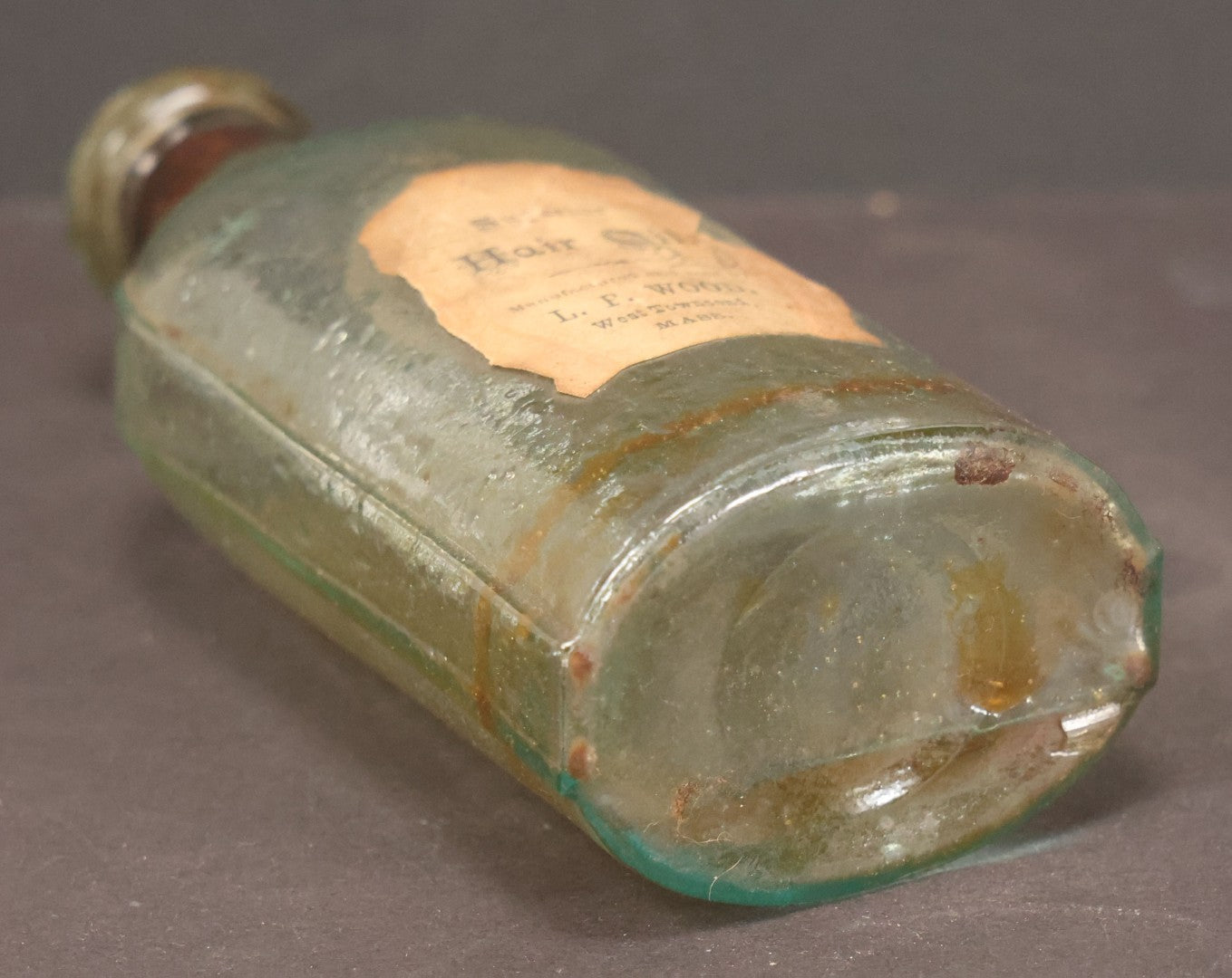 Lot 042 - Antique Superior Hair Oil Clear Glass Bottle With Cork And Remnants Of Contents, Paper Label, Manufactured And Sold By L.F. Wood, West Townsend, Massachusetts, 5-1/4" Height