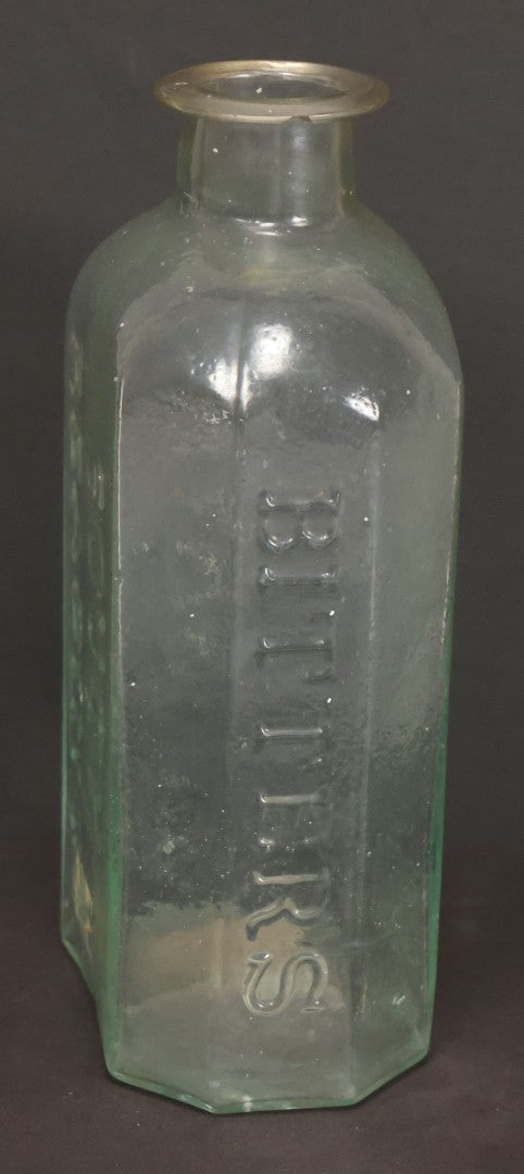 Lot 045 - Antique Hand Blown S.O. Richardson Bitters Green Tinted Clear Glass Bottle With Pontil, South Reading, Massachusetts, 6-1/2" Height