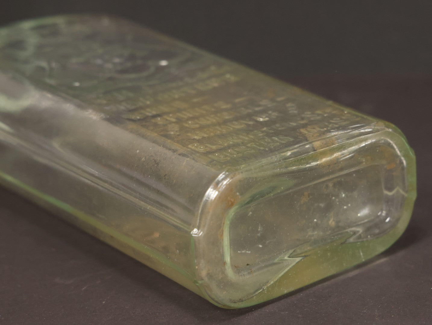 Lot 046 - Antique W.H. Jones & Co. Clear Glass Bottle With Bear Motif Trade Mark, Importers Of Wines, Spirits, And Cordials, Boston, Massachusetts, 8-3/8" Height