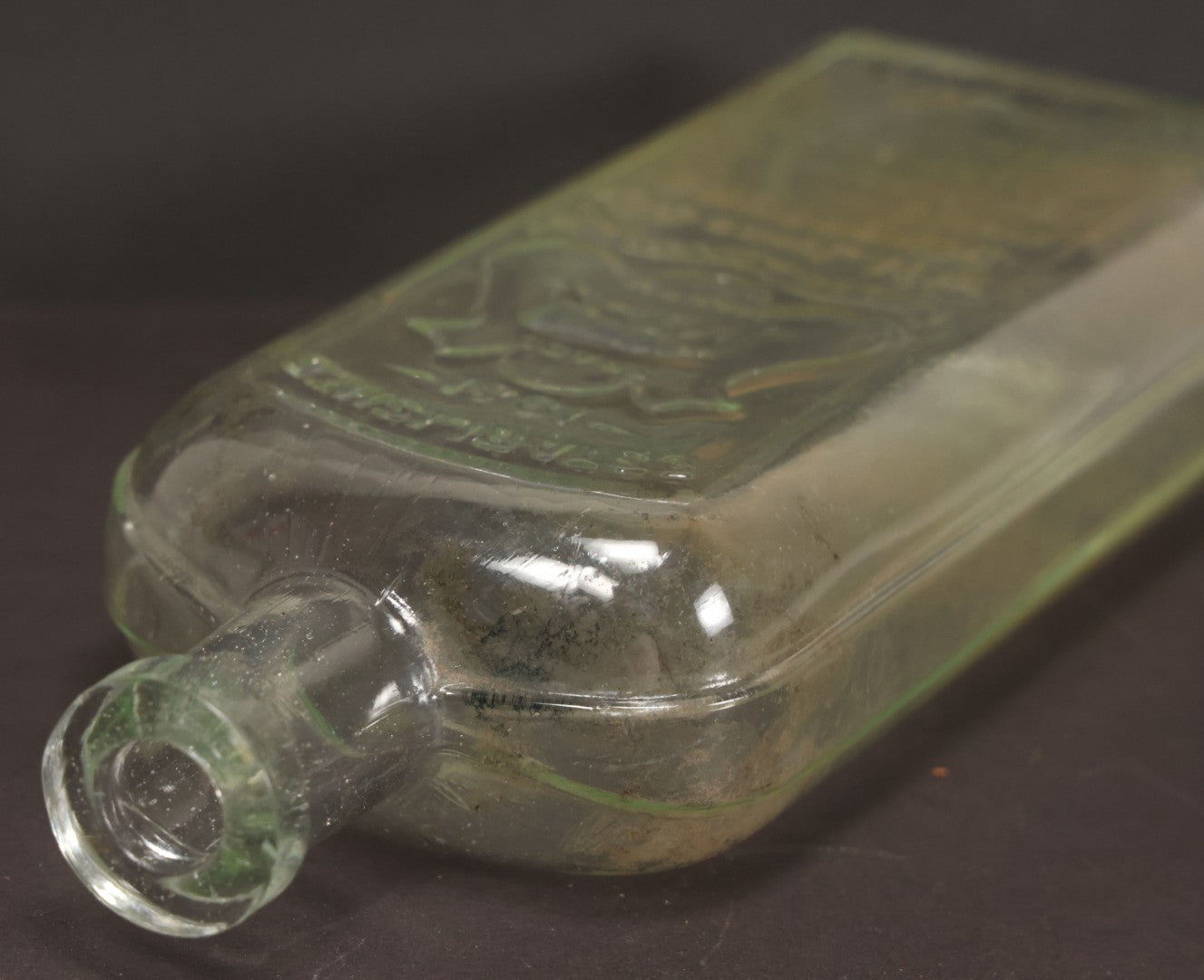 Lot 046 - Antique W.H. Jones & Co. Clear Glass Bottle With Bear Motif Trade Mark, Importers Of Wines, Spirits, And Cordials, Boston, Massachusetts, 8-3/8" Height