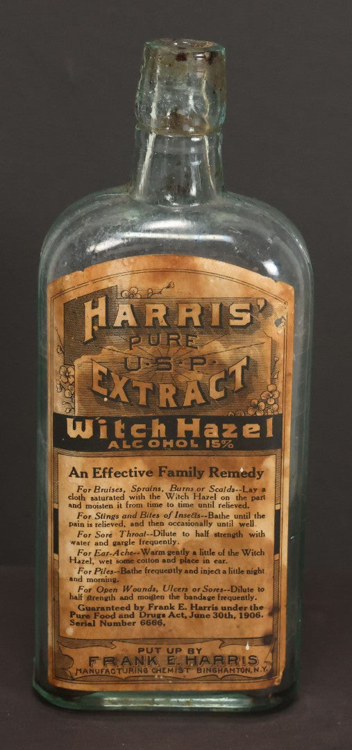 Lot 047 - Antique Harris' Pure Extract Witch Hazel Blue Tinted Clear Glass Bottle With Paper Label, Put Up By Frank E. Harris, Manufacturing Chemist, Binghamton, New York, 6-7/8" Height