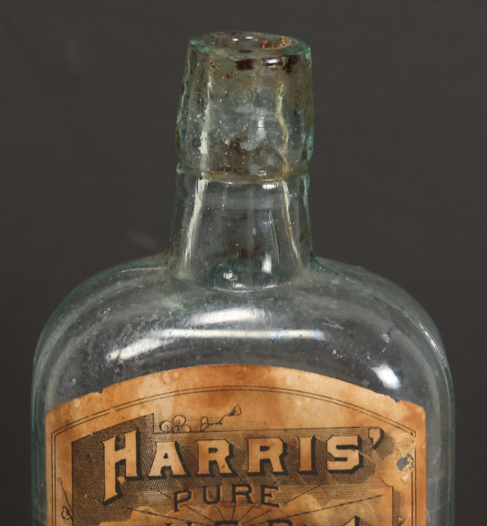 Lot 047 - Antique Harris' Pure Extract Witch Hazel Blue Tinted Clear Glass Bottle With Paper Label, Put Up By Frank E. Harris, Manufacturing Chemist, Binghamton, New York, 6-7/8" Height