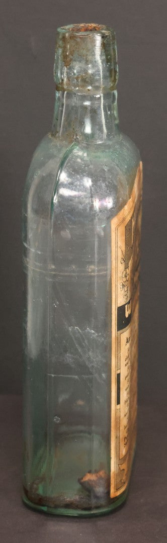 Lot 047 - Antique Harris' Pure Extract Witch Hazel Blue Tinted Clear Glass Bottle With Paper Label, Put Up By Frank E. Harris, Manufacturing Chemist, Binghamton, New York, 6-7/8" Height
