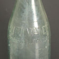 Lot 048 - Antique Pluto Water Green Tinted Clear Glass Bottle With Underside Embossed Devil Motif Logo, "America's Physic", 11" Height