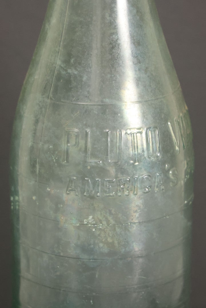 Lot 048 - Antique Pluto Water Green Tinted Clear Glass Bottle With Underside Embossed Devil Motif Logo, "America's Physic", 11" Height