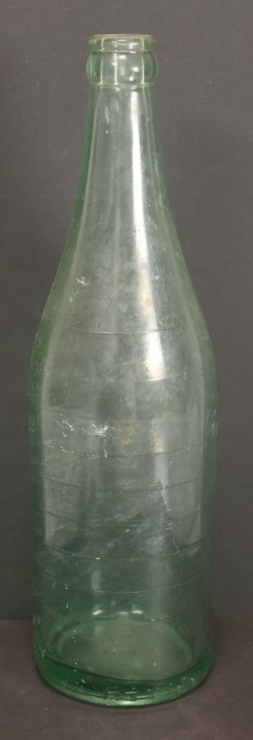 Lot 048 - Antique Pluto Water Green Tinted Clear Glass Bottle With Underside Embossed Devil Motif Logo, "America's Physic", 11" Height