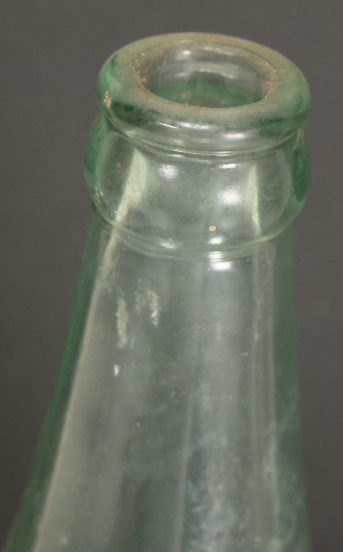 Lot 048 - Antique Pluto Water Green Tinted Clear Glass Bottle With Underside Embossed Devil Motif Logo, "America's Physic", 11" Height