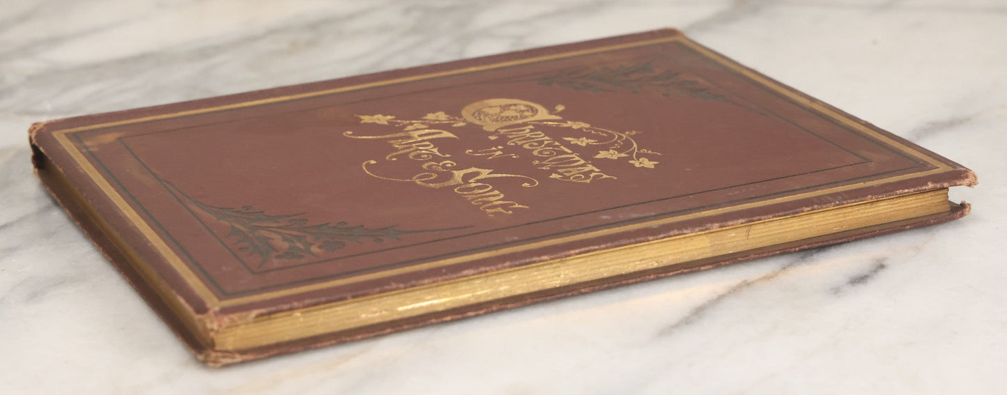 Lot 050 - "Christmas In Art & Song" Antique Book With 40+ Illustrations, Many Full Page Plates, With Christmas 1878  Gift Inscription, Gilt Lettering, Gold And Black Mistletoe Motif, On Cover, The Arundel Printing And Publishing Company, New York, 1879