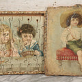 Lot 062 - Antique Double Sided Victorian Lithographed Wood Cut Jigsaw Puzzle With Scene Of Children In Costume With Clown And Children Blowing Bubbles, With Original Box And Partial Lithographed Lid