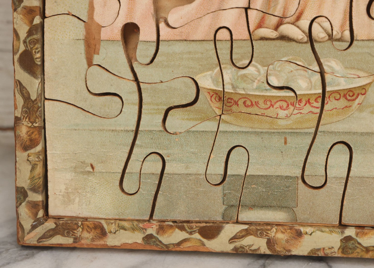 Lot 062 - Antique Double Sided Victorian Lithographed Wood Cut Jigsaw Puzzle With Scene Of Children In Costume With Clown And Children Blowing Bubbles, With Original Box And Partial Lithographed Lid