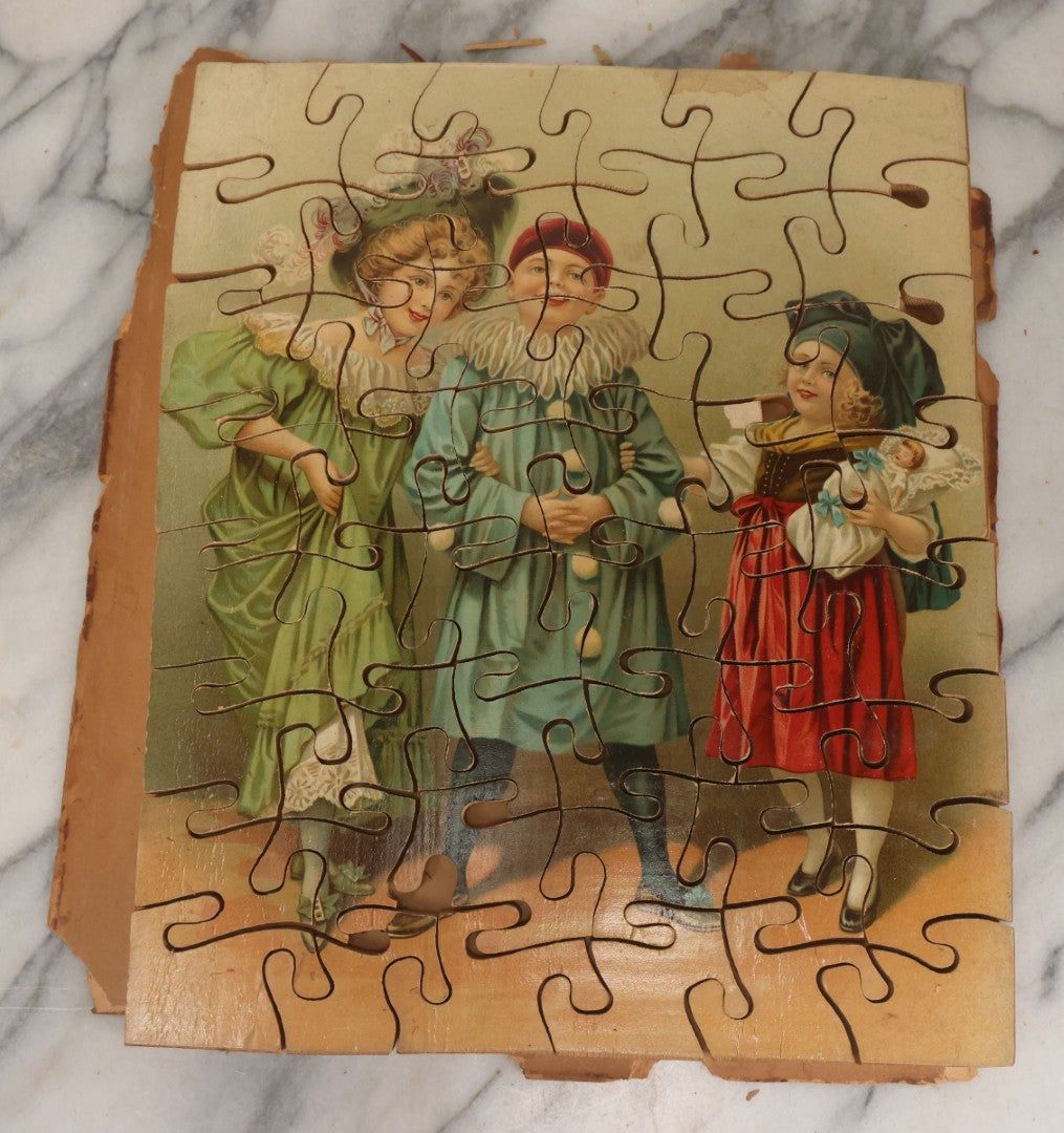 Lot 062 - Antique Double Sided Victorian Lithographed Wood Cut Jigsaw Puzzle With Scene Of Children In Costume With Clown And Children Blowing Bubbles, With Original Box And Partial Lithographed Lid