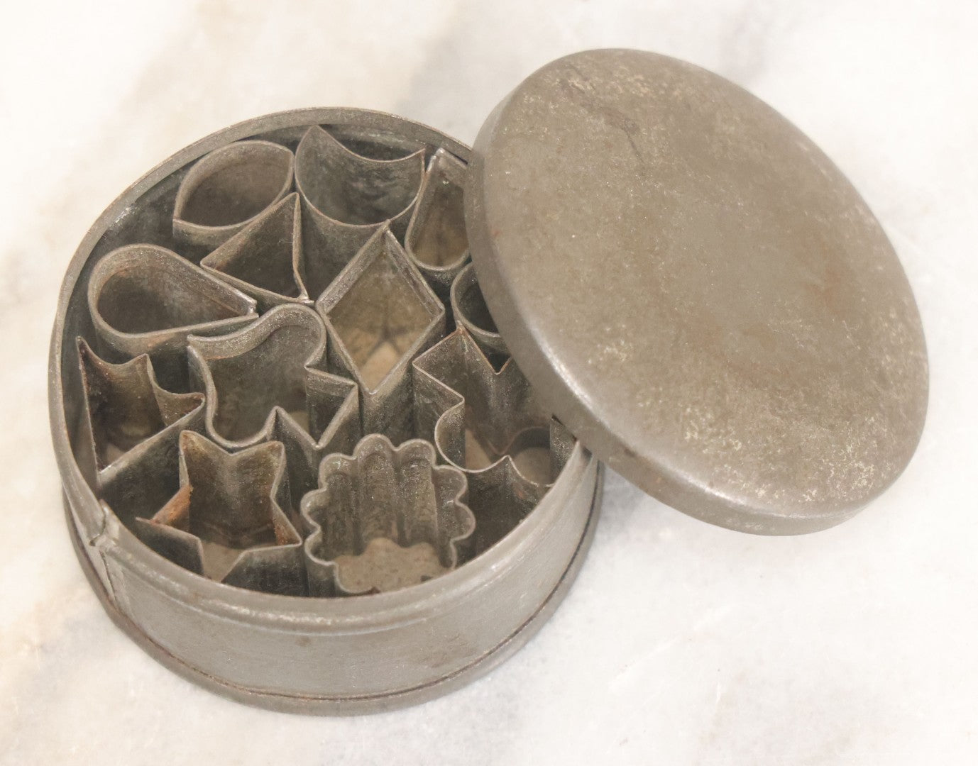 Lot 073 - Antique Miniature Cookie Cutters Set Of Twelve In Original Tin, Various Shapes Including Card Suites, Star, Etc., G.M.T. Co., Germany