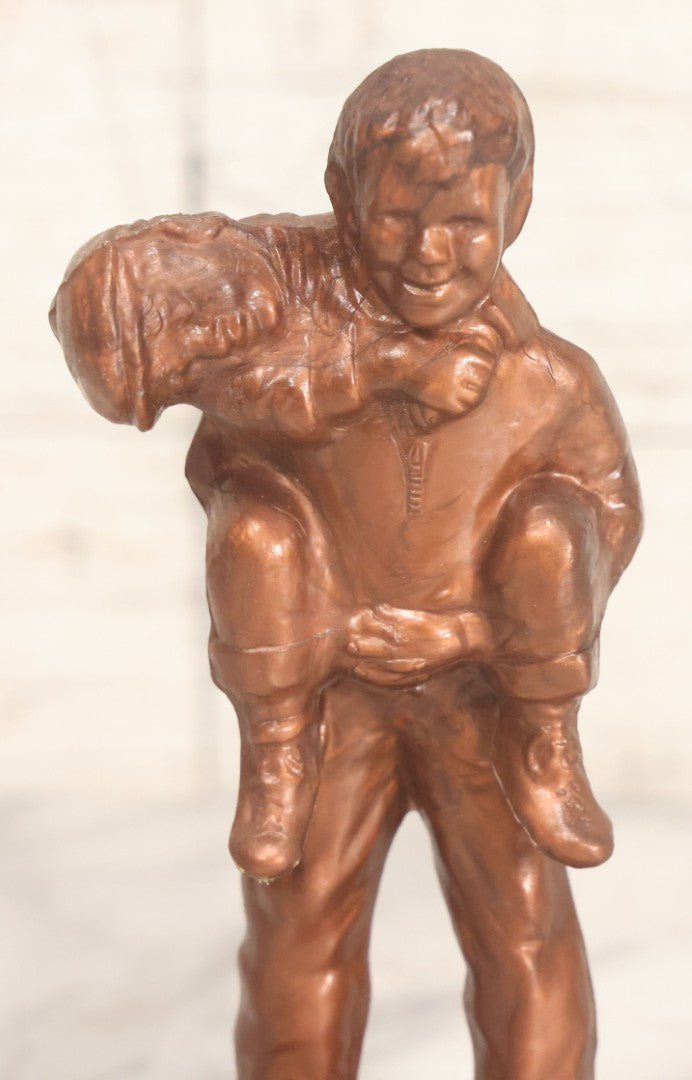 Lot 076 - Vintage Plastic Souvenir Statue Toy From "Father Flanagan's Boys Home," Boys Town, Nebraska, Two Young Boys Horsing Around, "He Ain't Heavy Father, He's My Brother"