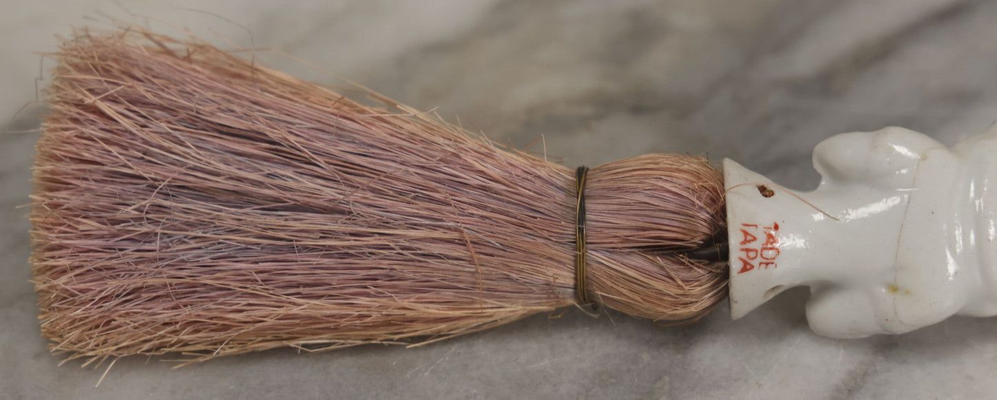 Lot 078 - Vintage Porcelain Lady With Blue Hat, Green Bow, Straw Dresser Brush, Made In Japan, Note Crack, Repair, 5-1/2" Length