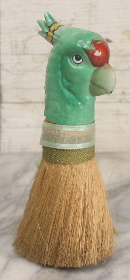 Lot 079 - Vintage Green Painted Porcelain Parrot Head Straw Dresser Brush With Green Ribbon, Made In Japan, 7-1/2" Length