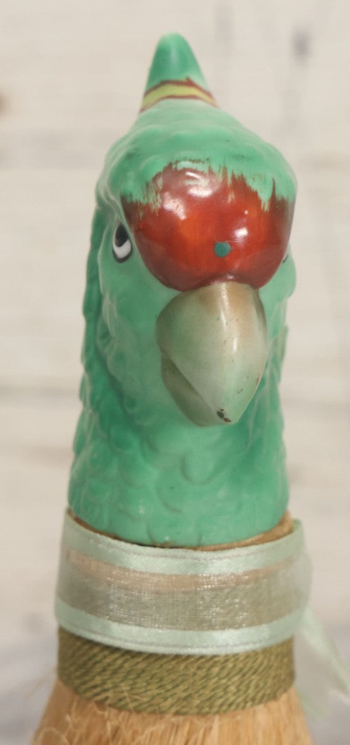 Lot 079 - Vintage Green Painted Porcelain Parrot Head Straw Dresser Brush With Green Ribbon, Made In Japan, 7-1/2" Length
