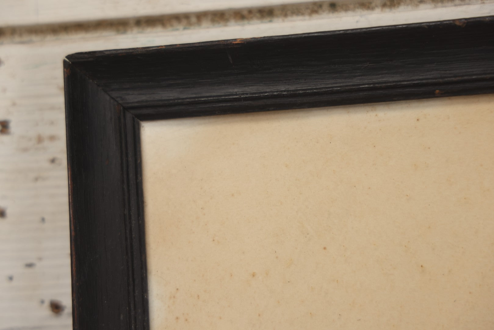 Lot 004 - Antique Watercolor Painting Of Native American Woman Holding A Staff Standing By Canoe In Black Painted Wood Frame, 10-1/2" x 20"