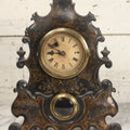 Lot 006 - Antique Metal And Wood Mantel Clock With Hand Painted Details, Paper Clock Face, And Domed Pendulum Window, With Paper Label Inside, Manufactured By The Waterbury Clock Co., Waterbury, Connecticut, Untested, No Pendulum, 13-1/8" H