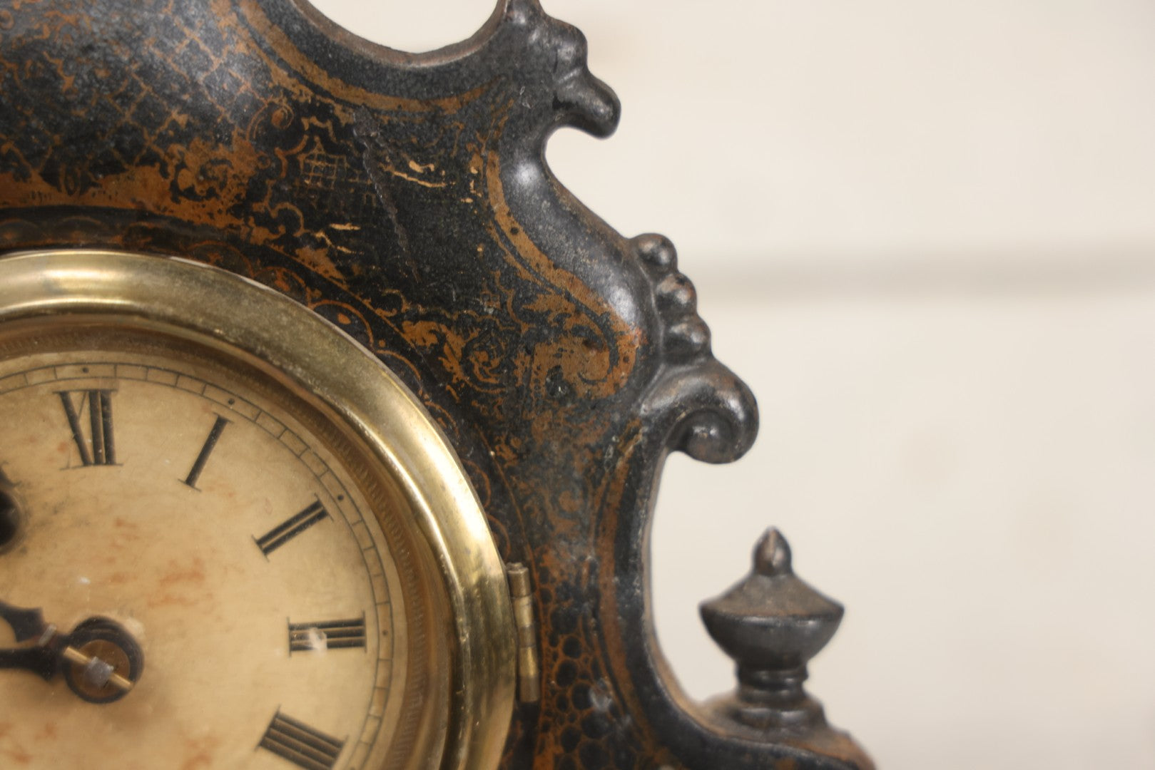 Lot 006 - Antique Metal And Wood Mantel Clock With Hand Painted Details, Paper Clock Face, And Domed Pendulum Window, With Paper Label Inside, Manufactured By The Waterbury Clock Co., Waterbury, Connecticut, Untested, No Pendulum, 13-1/8" H