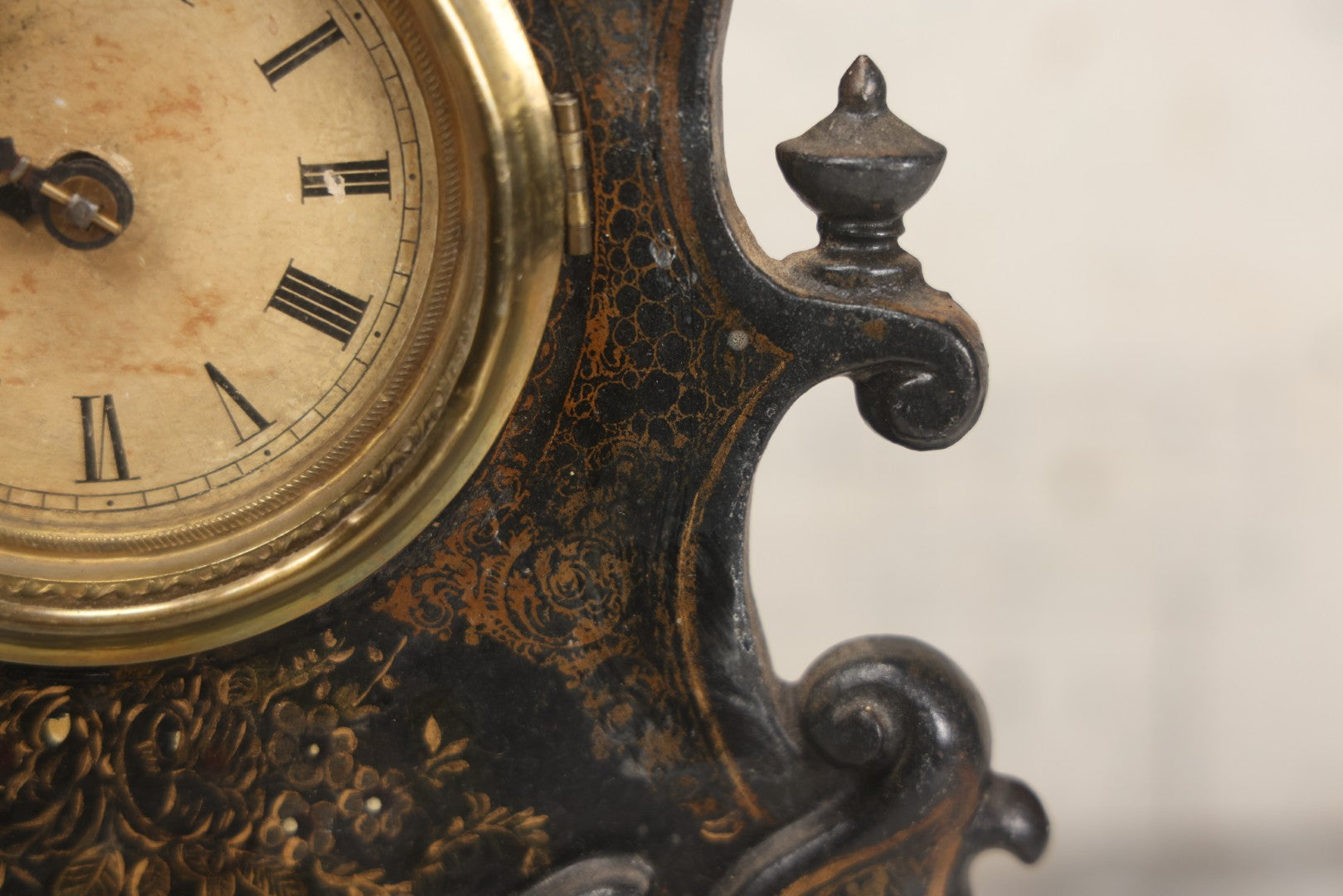 Lot 006 - Antique Metal And Wood Mantel Clock With Hand Painted Details, Paper Clock Face, And Domed Pendulum Window, With Paper Label Inside, Manufactured By The Waterbury Clock Co., Waterbury, Connecticut, Untested, No Pendulum, 13-1/8" H