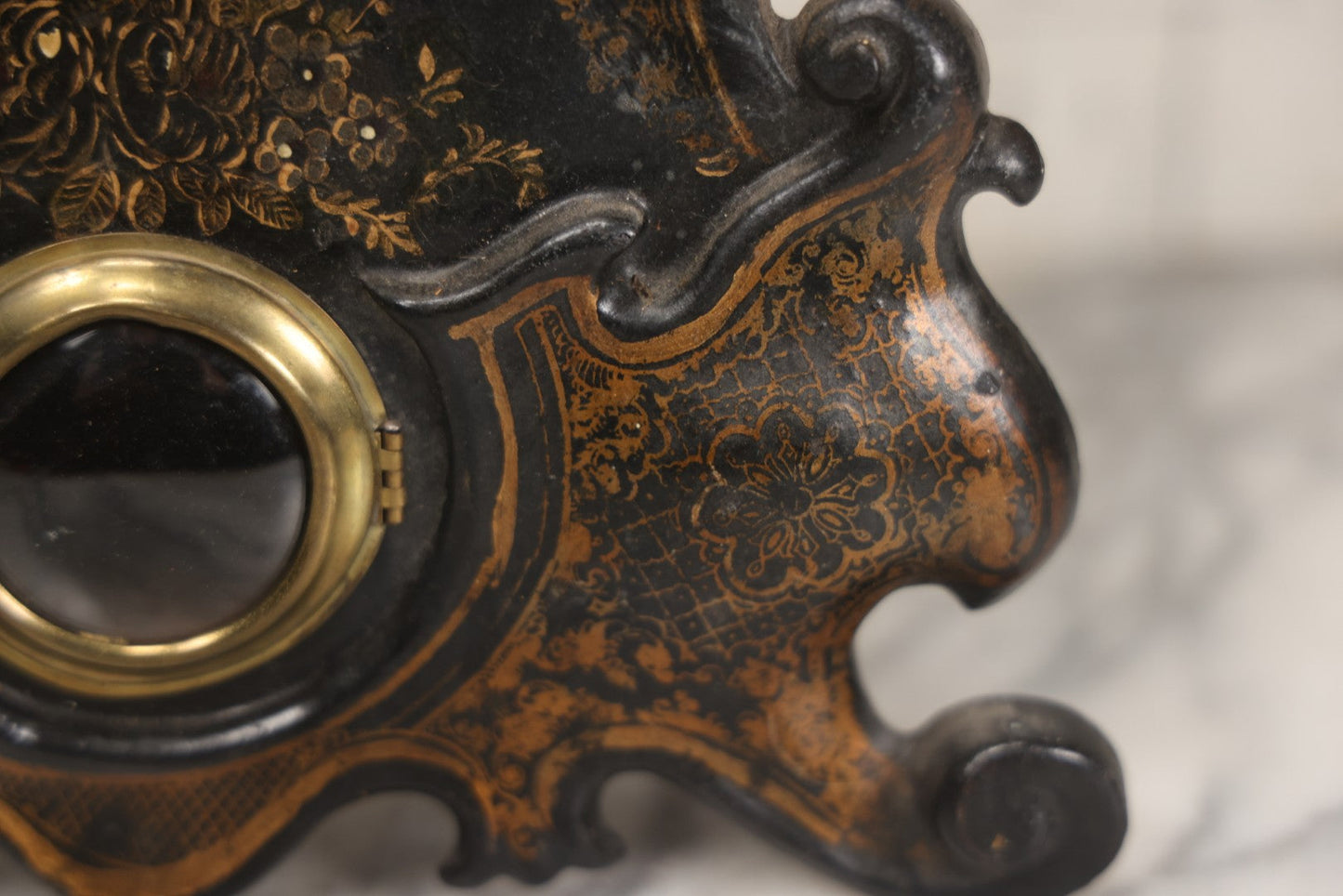 Lot 006 - Antique Metal And Wood Mantel Clock With Hand Painted Details, Paper Clock Face, And Domed Pendulum Window, With Paper Label Inside, Manufactured By The Waterbury Clock Co., Waterbury, Connecticut, Untested, No Pendulum, 13-1/8" H