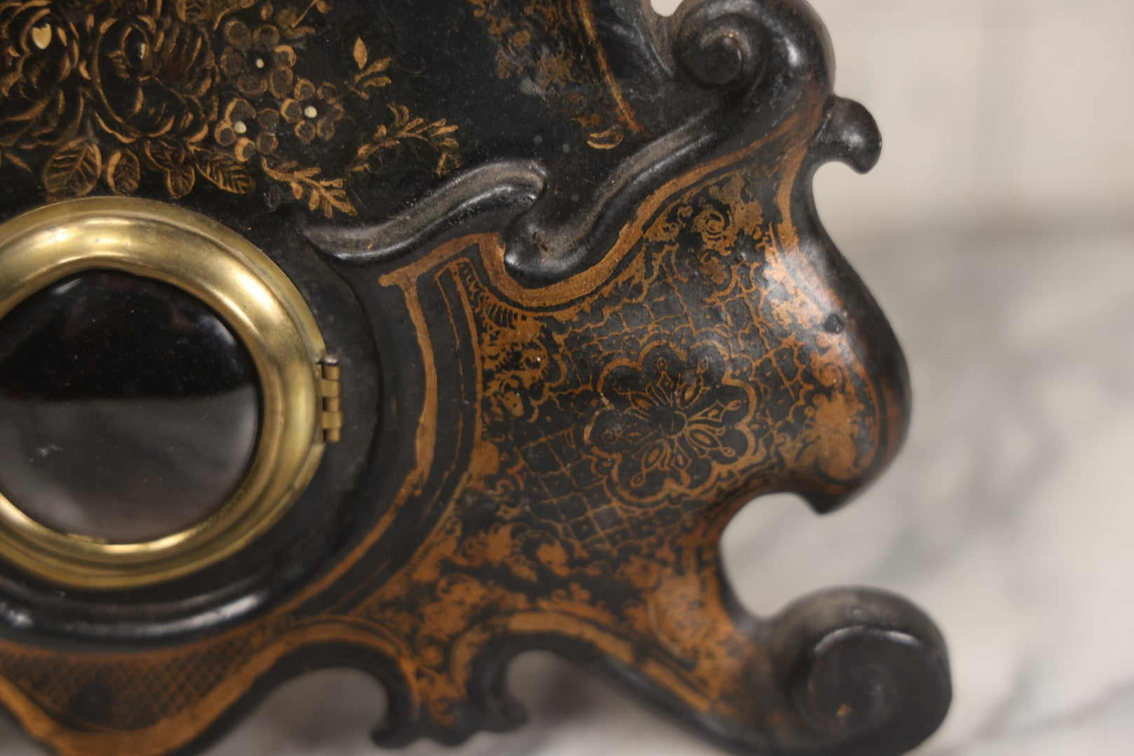 Lot 006 - Antique Metal And Wood Mantel Clock With Hand Painted Details, Paper Clock Face, And Domed Pendulum Window, With Paper Label Inside, Manufactured By The Waterbury Clock Co., Waterbury, Connecticut, Untested, No Pendulum, 13-1/8" H