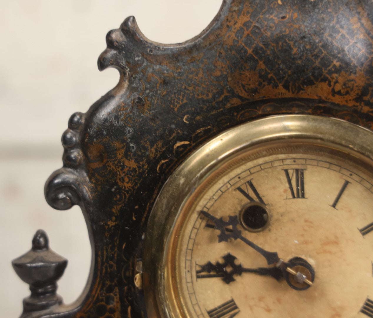 Lot 006 - Antique Metal And Wood Mantel Clock With Hand Painted Details, Paper Clock Face, And Domed Pendulum Window, With Paper Label Inside, Manufactured By The Waterbury Clock Co., Waterbury, Connecticut, Untested, No Pendulum, 13-1/8" H