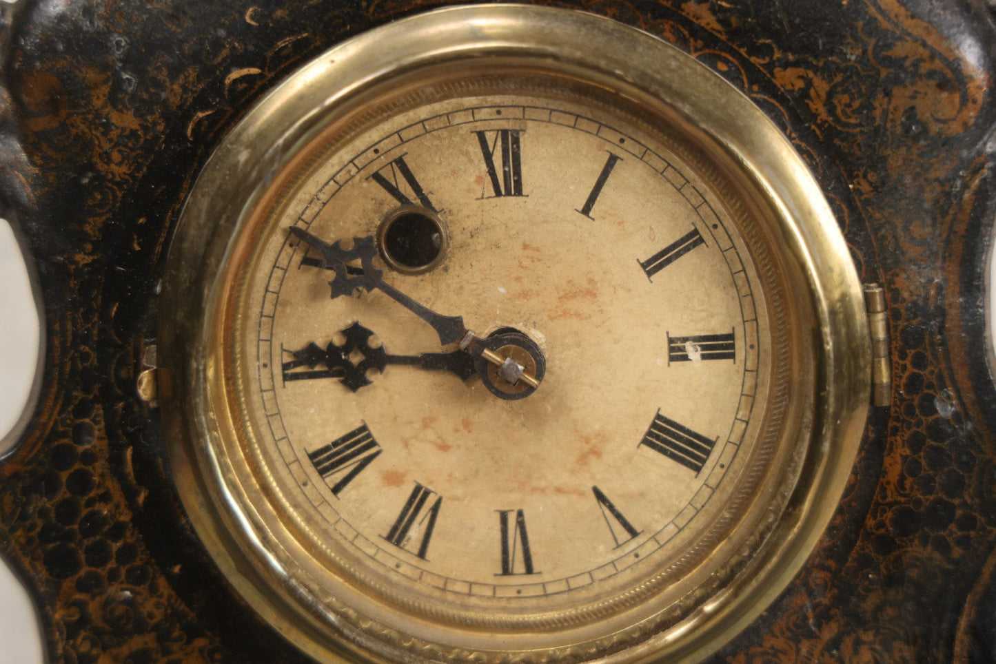 Lot 006 - Antique Metal And Wood Mantel Clock With Hand Painted Details, Paper Clock Face, And Domed Pendulum Window, With Paper Label Inside, Manufactured By The Waterbury Clock Co., Waterbury, Connecticut, Untested, No Pendulum, 13-1/8" H