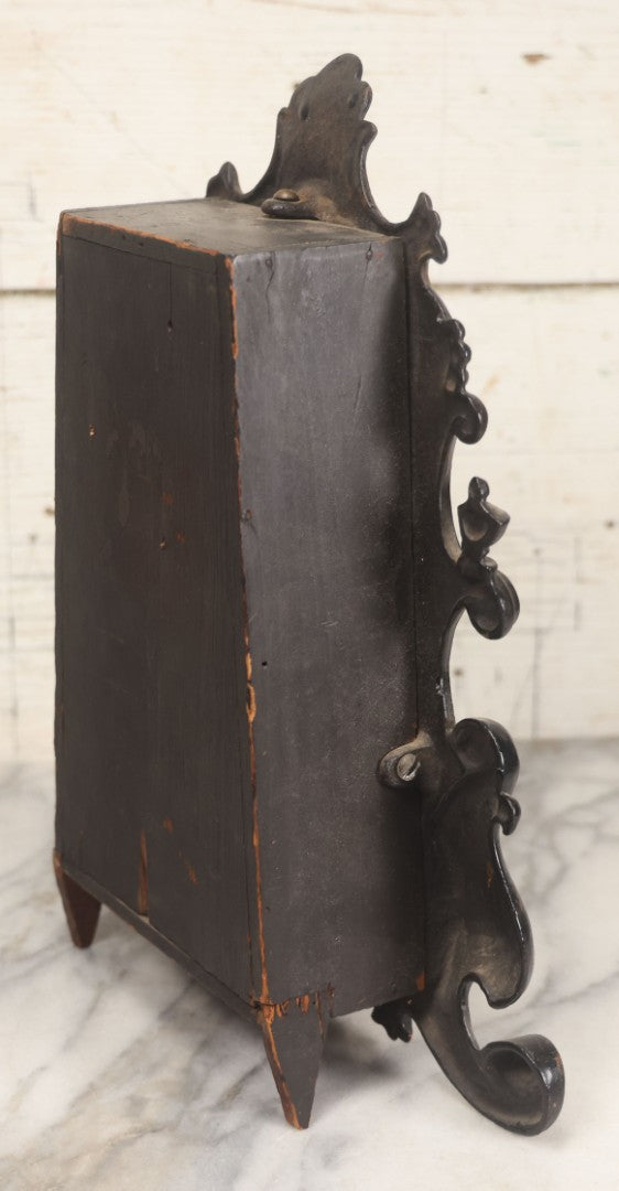 Lot 006 - Antique Metal And Wood Mantel Clock With Hand Painted Details, Paper Clock Face, And Domed Pendulum Window, With Paper Label Inside, Manufactured By The Waterbury Clock Co., Waterbury, Connecticut, Untested, No Pendulum, 13-1/8" H