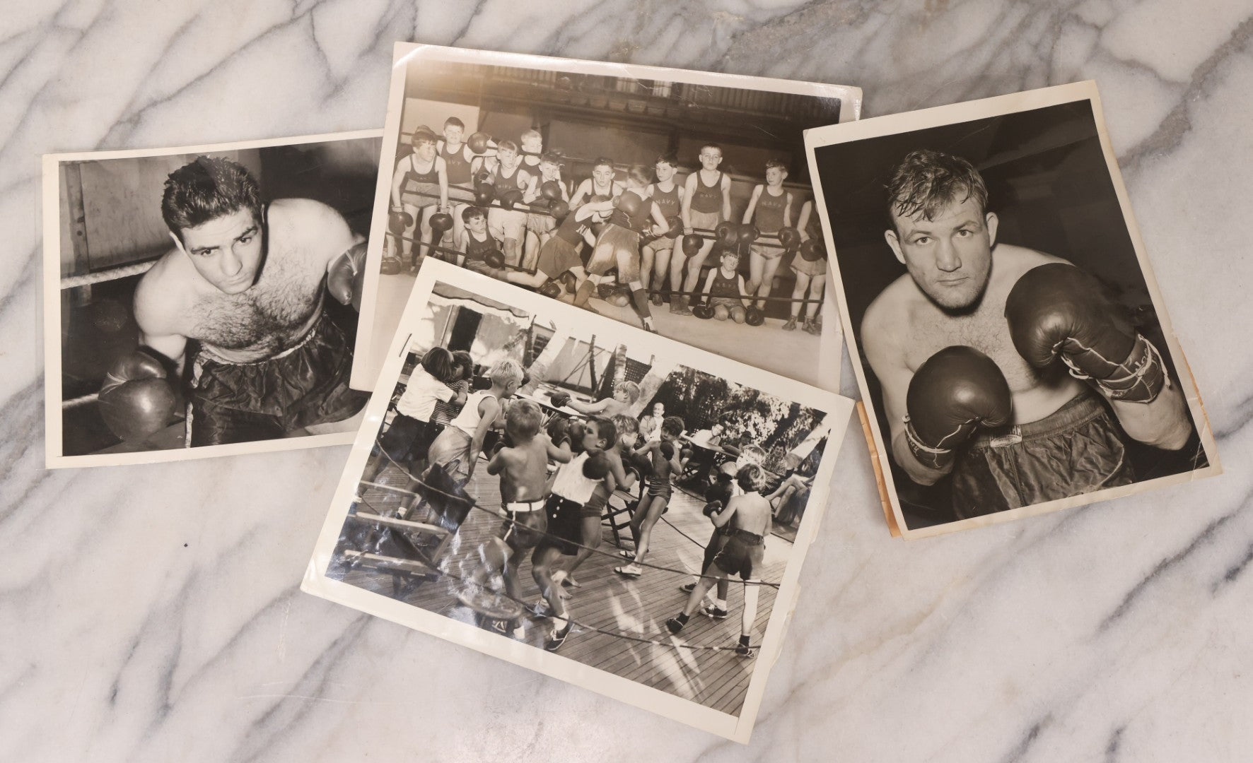 Lot 104 - Grouping Of Four Vintage Glossy Boxing Related Photographs Including A Brawl Of Young Boys, A Match Between Two Young Boys In Navy Tank Tops, Boxing Promo Photos Of Joe Baksi And Melio Bettina