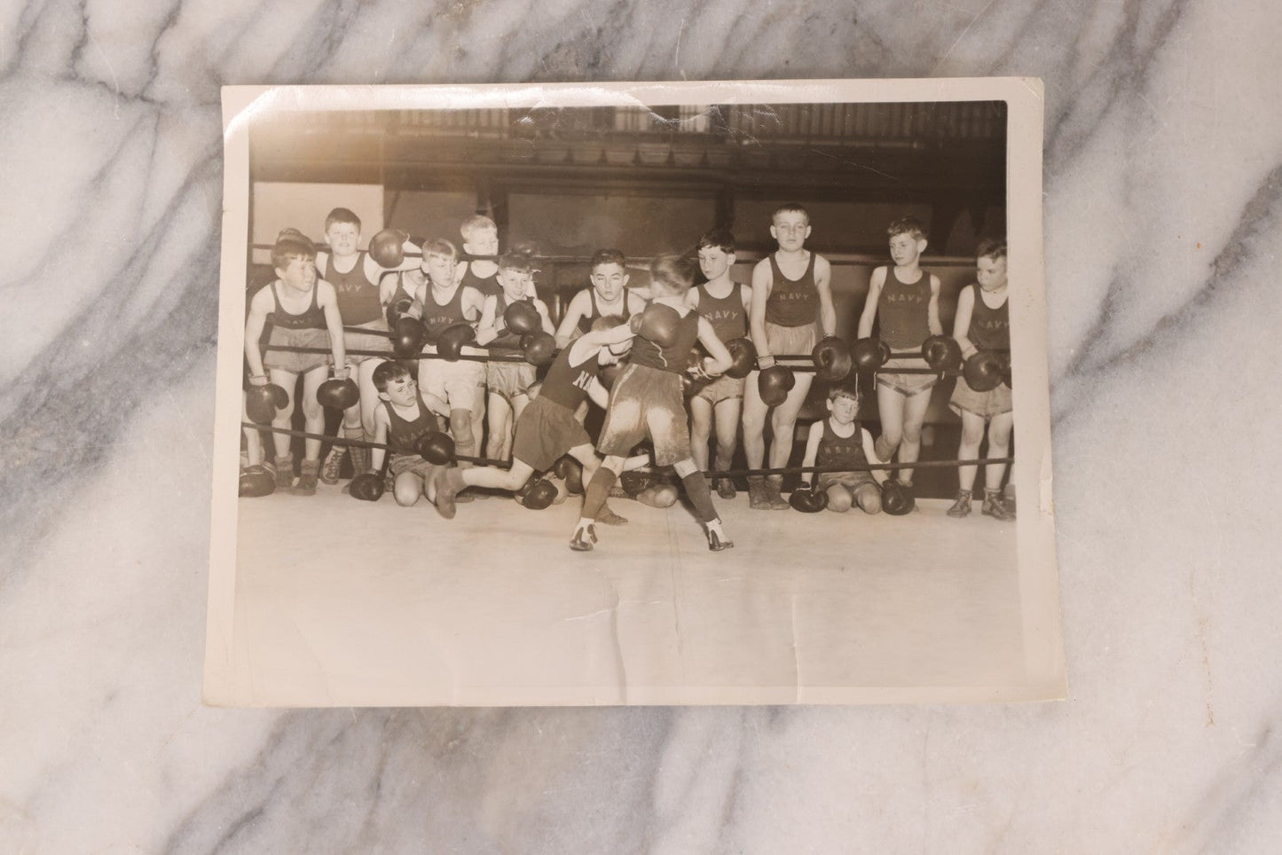 Lot 104 - Grouping Of Four Vintage Glossy Boxing Related Photographs Including A Brawl Of Young Boys, A Match Between Two Young Boys In Navy Tank Tops, Boxing Promo Photos Of Joe Baksi And Melio Bettina