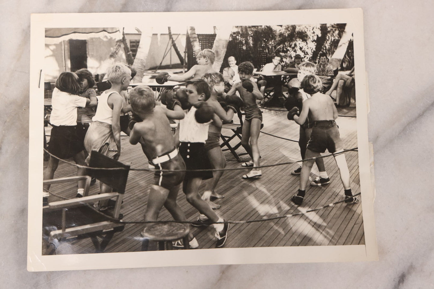 Lot 104 - Grouping Of Four Vintage Glossy Boxing Related Photographs Including A Brawl Of Young Boys, A Match Between Two Young Boys In Navy Tank Tops, Boxing Promo Photos Of Joe Baksi And Melio Bettina