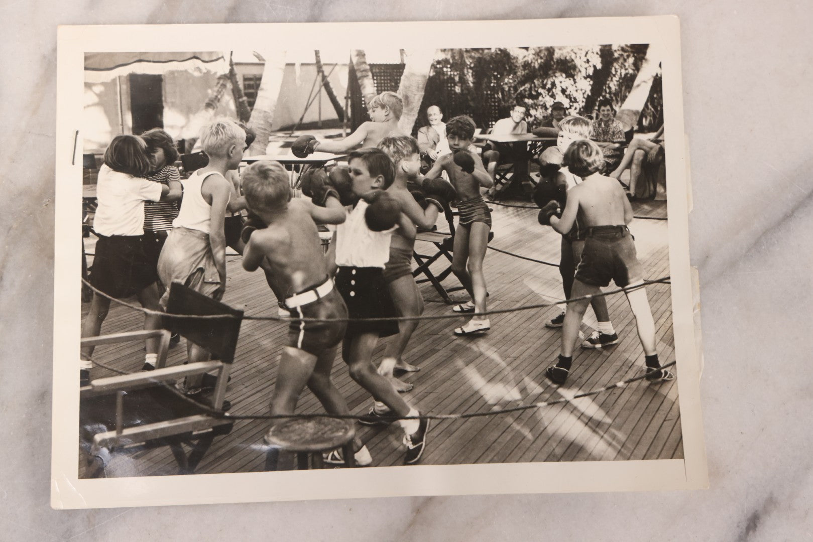 Lot 104 - Grouping Of Four Vintage Glossy Boxing Related Photographs Including A Brawl Of Young Boys, A Match Between Two Young Boys In Navy Tank Tops, Boxing Promo Photos Of Joe Baksi And Melio Bettina