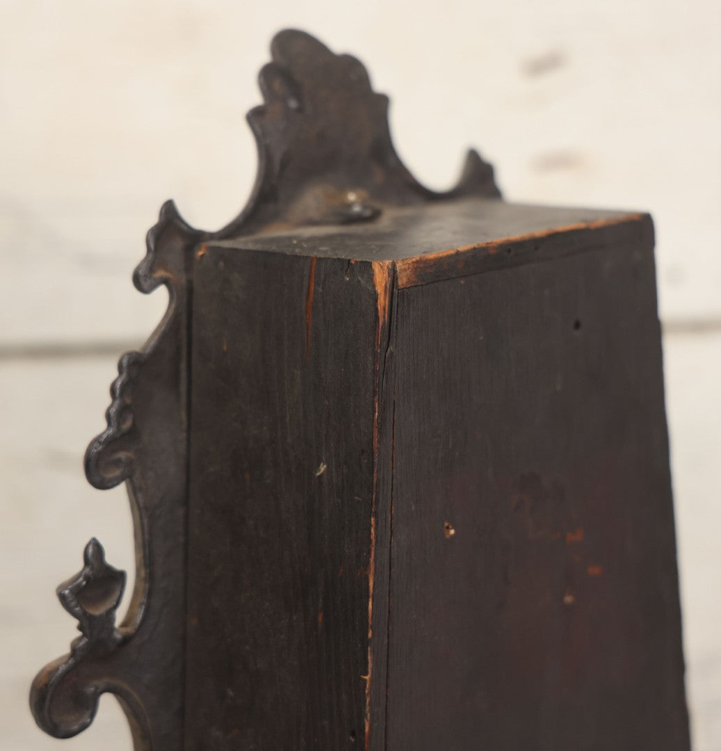 Lot 006 - Antique Metal And Wood Mantel Clock With Hand Painted Details, Paper Clock Face, And Domed Pendulum Window, With Paper Label Inside, Manufactured By The Waterbury Clock Co., Waterbury, Connecticut, Untested, No Pendulum, 13-1/8" H