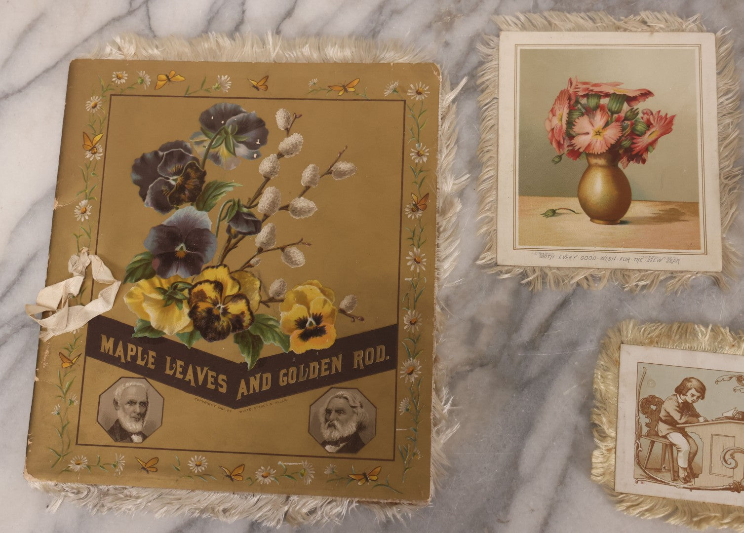 Lot 117 - Four Piece Antique Lithographed Ephemera Grouping With Fuzzy Fringe Including "Maple Leaves And Goldenrod" Illustrated Poetry Book And Three Christmas Cards