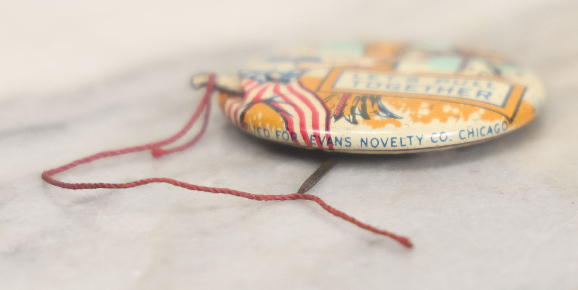 Lot 008 - Pair Of Vintage World War 2 Era Anti Hitler Pinback Buttons Including Animated Button Of Uncle Sam Hanging Hitler "Let's Pull Together," And "To Hell With Hitler" Blue Button