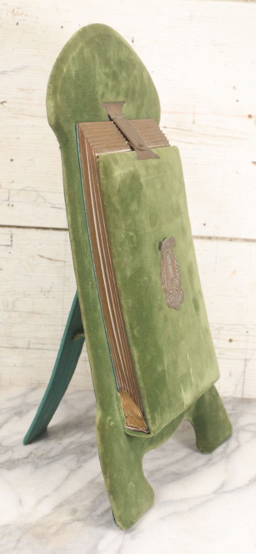 Lot 010 - Antique Victorian Green Velvet Display Photo Album With Stand And Tilt Down Cover, Brass Adornments, Containing 12 Cabinet Card And 24 C.D.V. Photographs And Images, Including Man Posing With Rifle, Sailor In Uniform, And Men Smoking