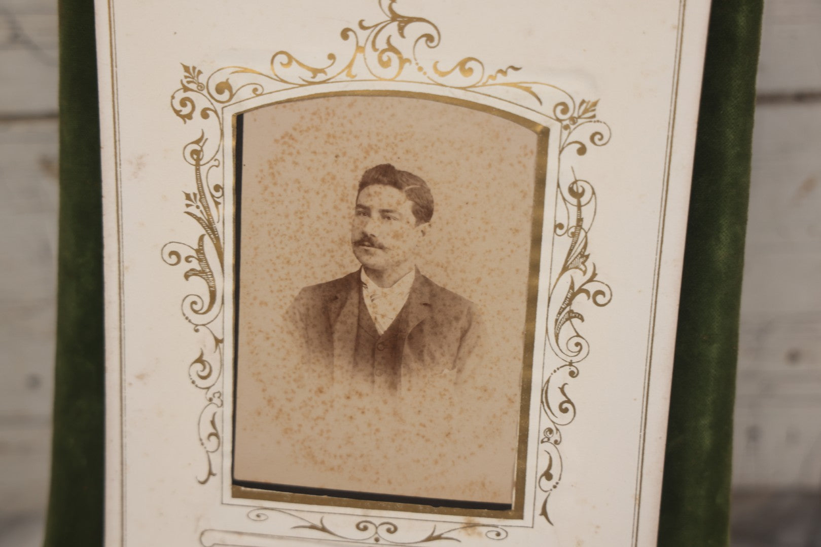 Lot 010 - Antique Victorian Green Velvet Display Photo Album With Stand And Tilt Down Cover, Brass Adornments, Containing 12 Cabinet Card And 24 C.D.V. Photographs And Images, Including Man Posing With Rifle, Sailor In Uniform, And Men Smoking